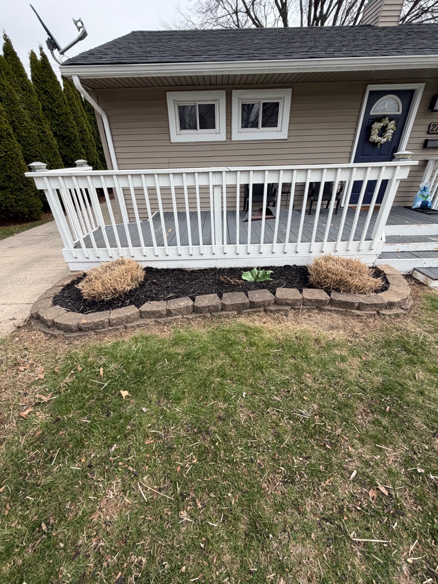 After: stone edging with fresh mulch by porch